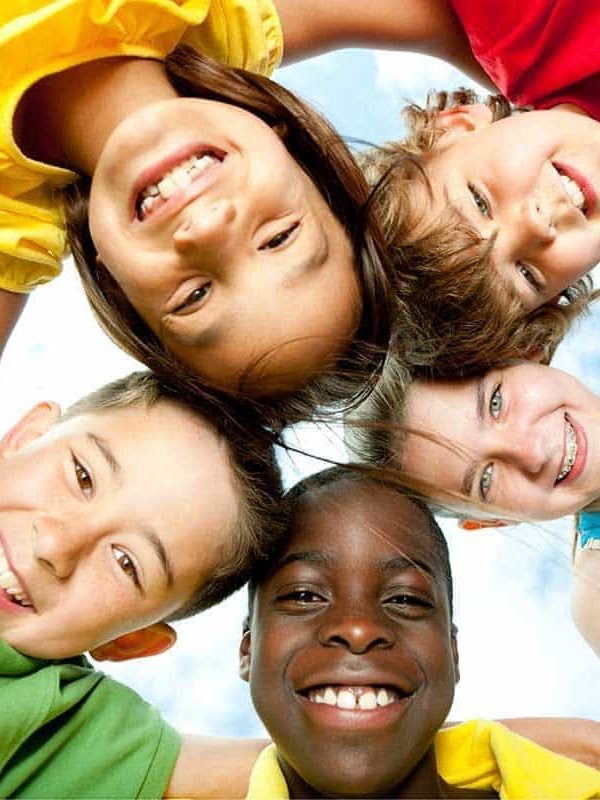 A group of diverse children playing outside.